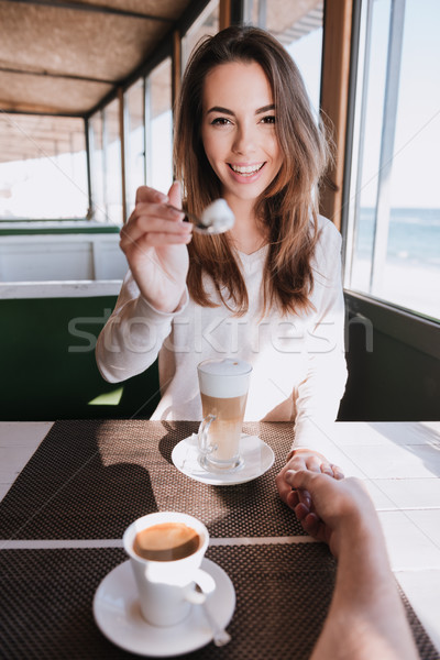 Vertical image of woman on date with coffee Stock photo © deandrobot