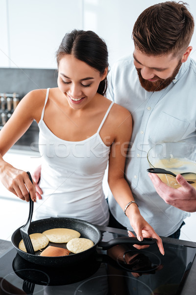 Attractive couple prepared pancake Stock photo © deandrobot
