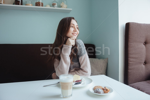 Woman in cafe having a breakfast with coffee and cake Stock photo © deandrobot