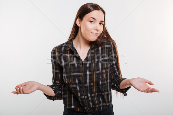 Woman in shirt does not understand Stock photo © deandrobot