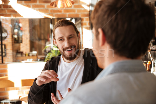 Stock photo: View from back of man with his friend near bar