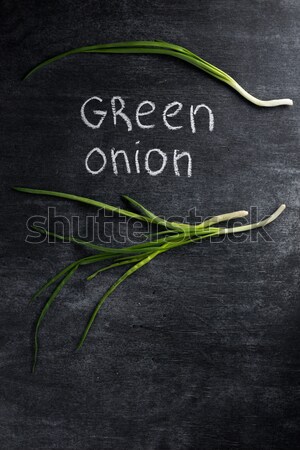 Yeşil soğan karanlık kara tahta üst görmek fotoğraf Stok fotoğraf © deandrobot