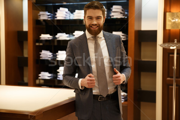 Happy man in shop Stock photo © deandrobot