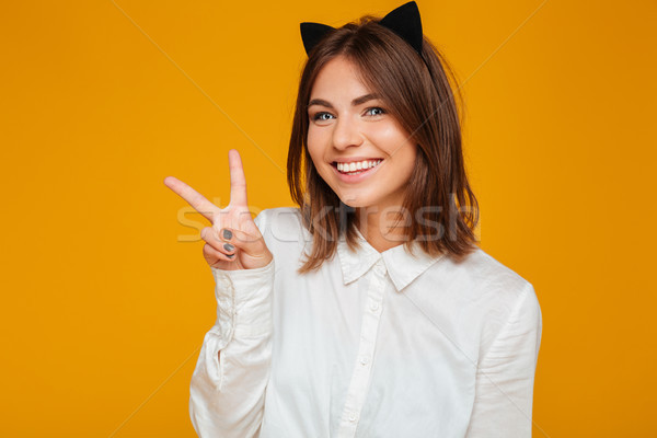 Stock photo: Smiling cheerful teenage schoolgirl with blue eyes