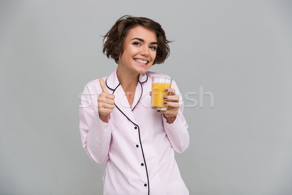Portrait of a cheerful young girl in pajamas Stock photo © deandrobot