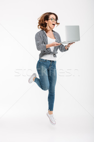 счастливым молодые Lady используя ноутбук компьютер Сток-фото © deandrobot