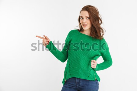 Foto stock: Retrato · sorridente · mulher · jovem · indicação · dedo · longe