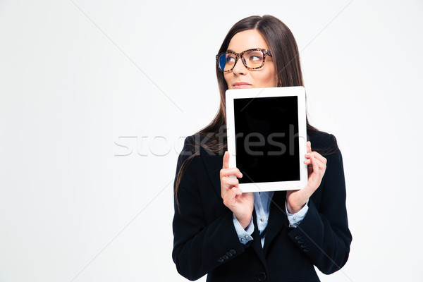 Thoughtful businesswoman showing tablet compute Stock photo © deandrobot