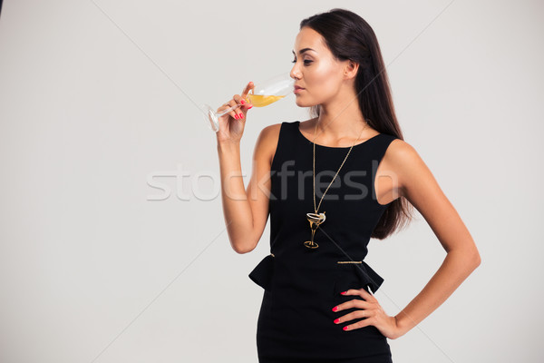 Retrato bela mulher potável champanhe isolado branco Foto stock © deandrobot