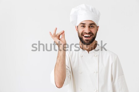 Smiling male chef cook showing ok sign Stock photo © deandrobot