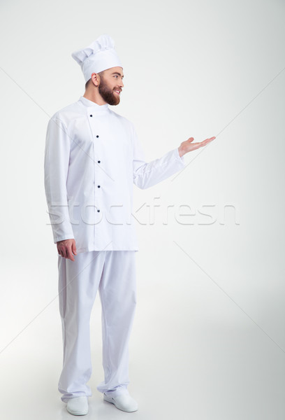 Stock photo: Chef cook showing copyspace on the palm 