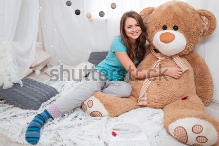 Cute fille grand peluche ours séance [[stock_photo]] © deandrobot