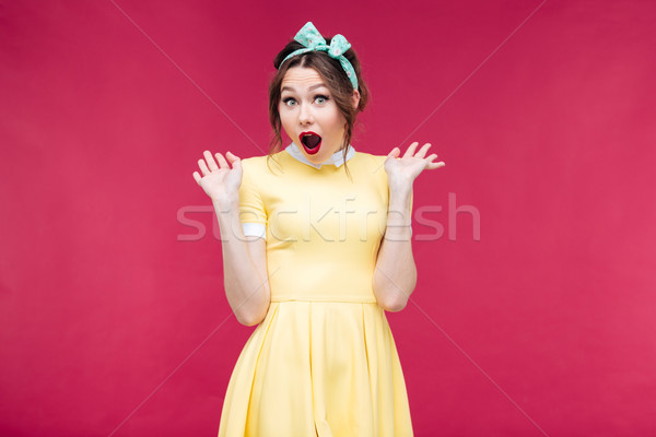 Surprised lovely pinup girl with mouth opened Stock photo © deandrobot