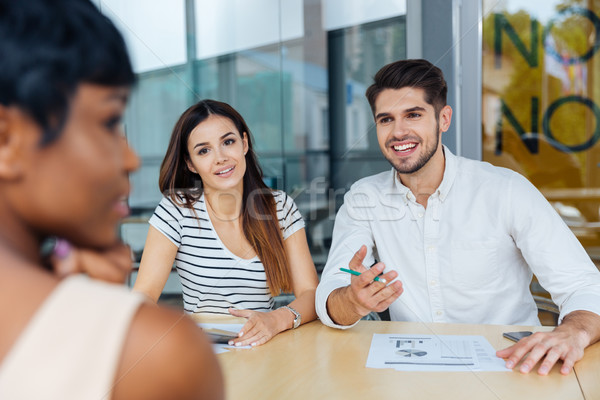 Business partners discussing ideas at meeting in office Stock photo © deandrobot