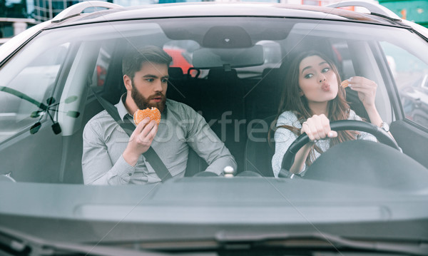 Front view of funny couple in car Stock photo © deandrobot