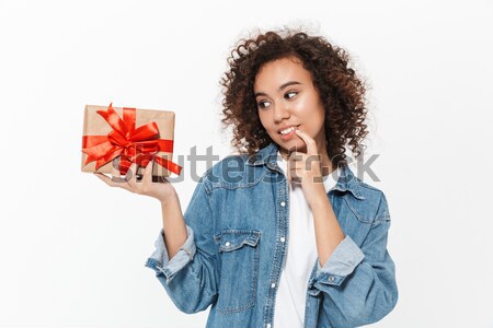 Happy african woman with gift Stock photo © deandrobot