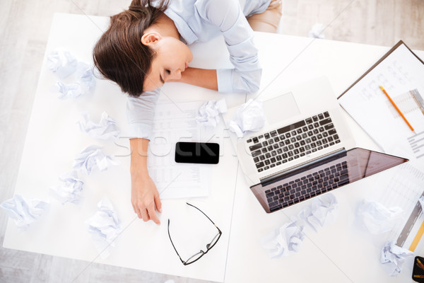 Fáradt nő irodai asztal alszik csukott szemmel fiatal Stock fotó © deandrobot