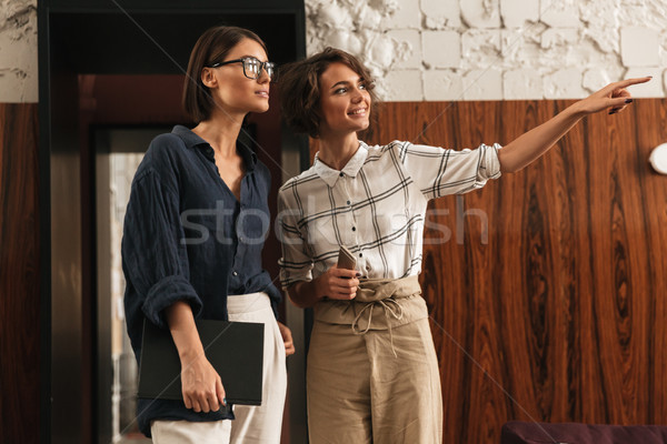 Two friends in co working office Stock photo © deandrobot