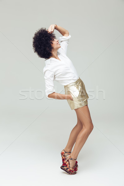 Cheerful retro woman dressed in shirt Stock photo © deandrobot