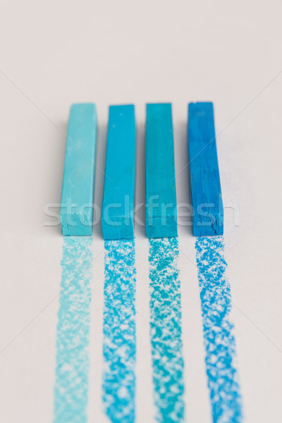 Close up of blue color pastel crayon chalks over its own trace l Stock photo © deandrobot