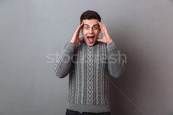 счастливым брюнетка человека свитер Сток-фото © deandrobot