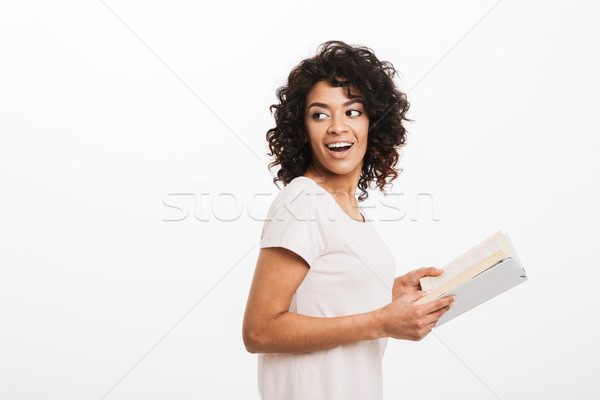 Portrait of a happy young afro american woman Stock photo © deandrobot