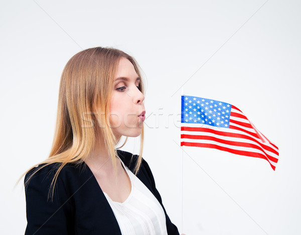 Businesswoman blowing on US flag Stock photo © deandrobot