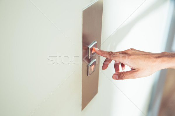 женщины пальца лифта кнопки Сток-фото © deandrobot