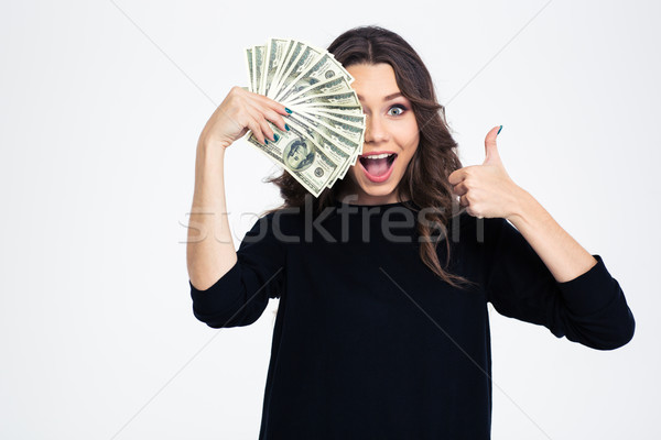 Girl covering her eye with dollar bills Stock photo © deandrobot