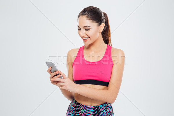 Foto stock: Sonriendo · mujer · de · la · aptitud · aislado · blanco · Internet