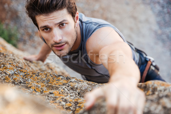 男子 岩 陡 懸崖 牆 商業照片 © deandrobot