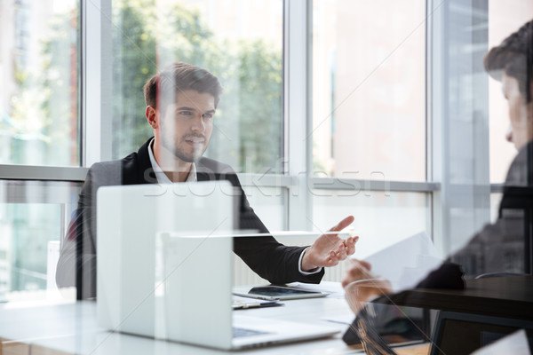 Dois empresários laptop reunião de negócios bonito jovem Foto stock © deandrobot