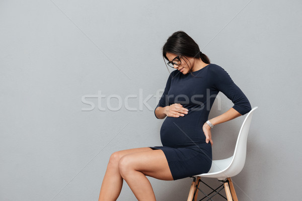 https://img3.stockfresh.com/files/d/deandrobot/m/54/8069443_stock-photo-tired-pregnant-business-woman-sitting-on-stool.jpg