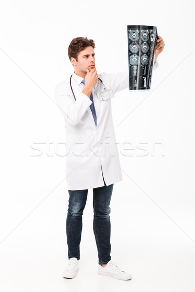 Portre genç erkek doktor tam uzunlukta dalgın stetoskop Stok fotoğraf © deandrobot