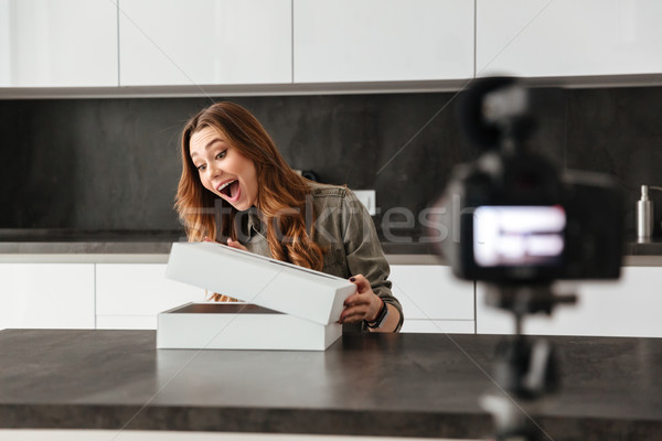 Excited young girl recording video blog episode Stock photo © deandrobot