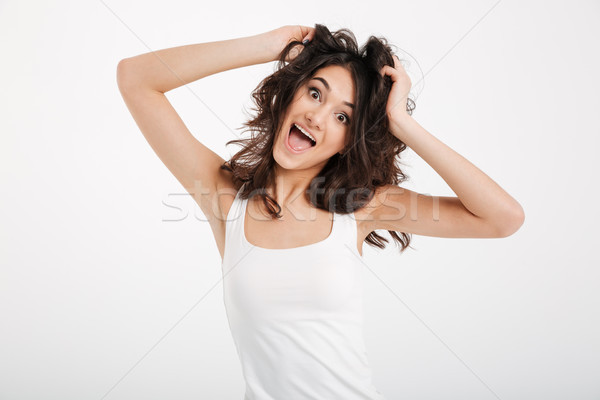 Portrait of a funny girl dressed in tank-top Stock photo © deandrobot