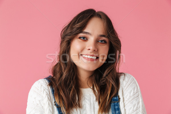 Pleased brunette woman in casual clothes posing Stock photo © deandrobot