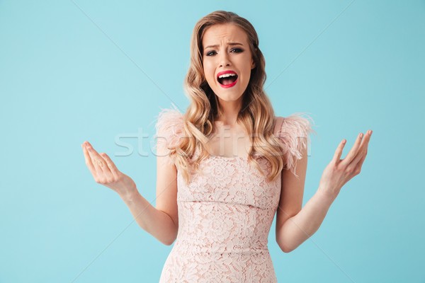 Confuso gritando mulher loira vestir olhando Foto stock © deandrobot