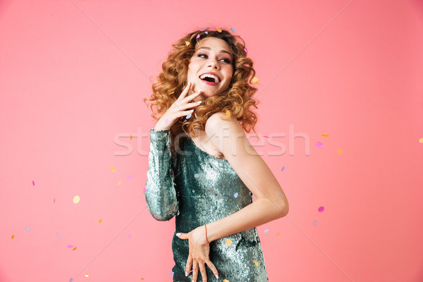 Portrait of a smiling beautiful woman in shiny dress Stock photo © deandrobot