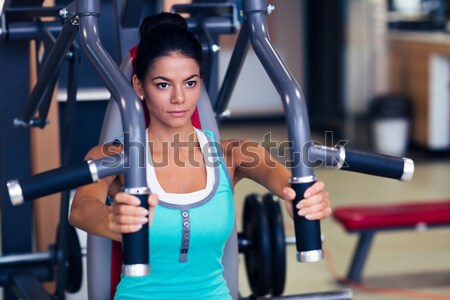 Sports woman doing abs exercises Stock photo © deandrobot