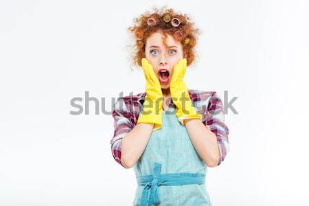 Amazed woman with foam on red hair in protective gloves  Stock photo © deandrobot