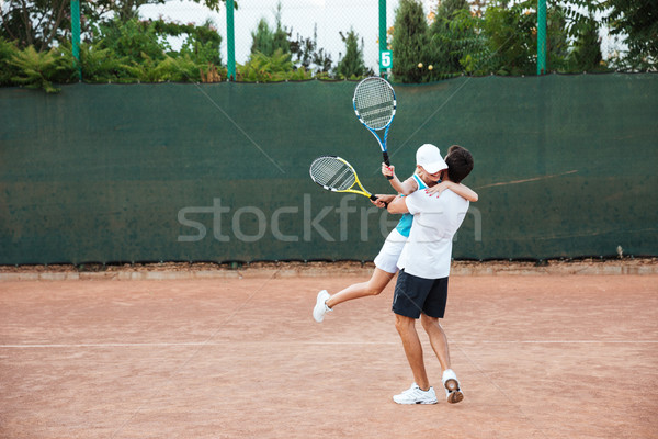 Szczęśliwy tenis gracze sportu wykonywania Zdjęcia stock © deandrobot