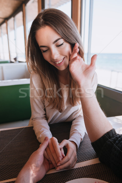 Verical image of beauty woman on date in cafe Stock photo © deandrobot