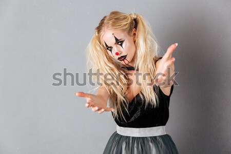 Happy woman which winks Stock photo © deandrobot