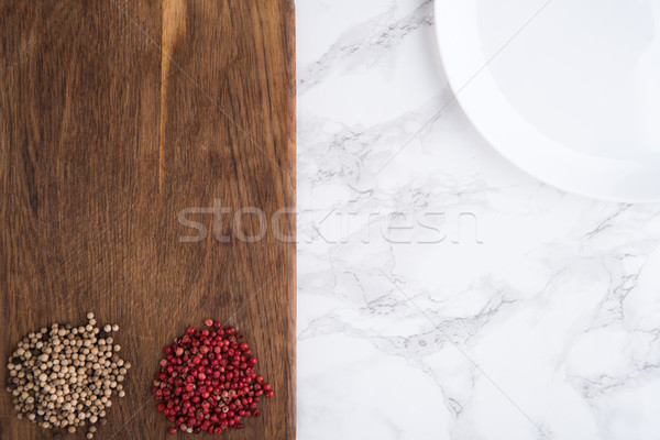 Top view of a spicy white and red peppercorn heaps Stock photo © deandrobot