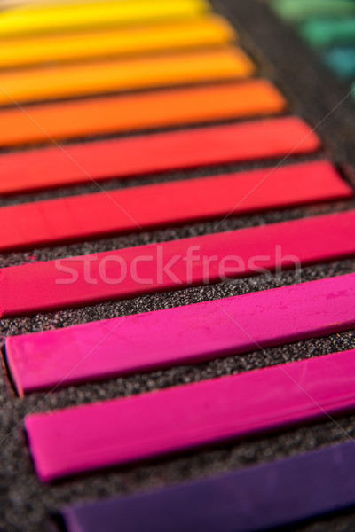 Cropped photo of new colorful chalk pastels in box Stock photo © deandrobot