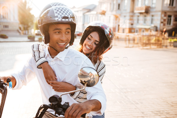 Imagem despreocupado africano casal moderno motocicleta Foto stock © deandrobot