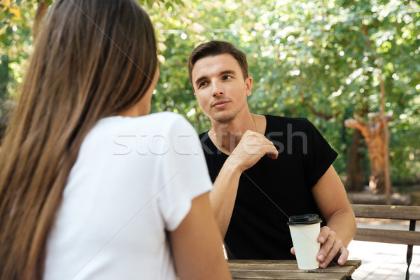 Giovani annoiato uomo seduta bere caffè Foto d'archivio © deandrobot