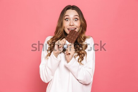 Happy young woman with watch on hand winking. Stock photo © deandrobot
