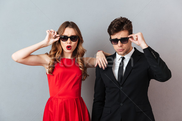 Portrait of a attractive young couple dressed in formal wear Stock photo © deandrobot